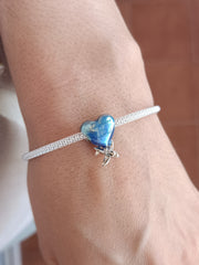 Charm corazón viajero