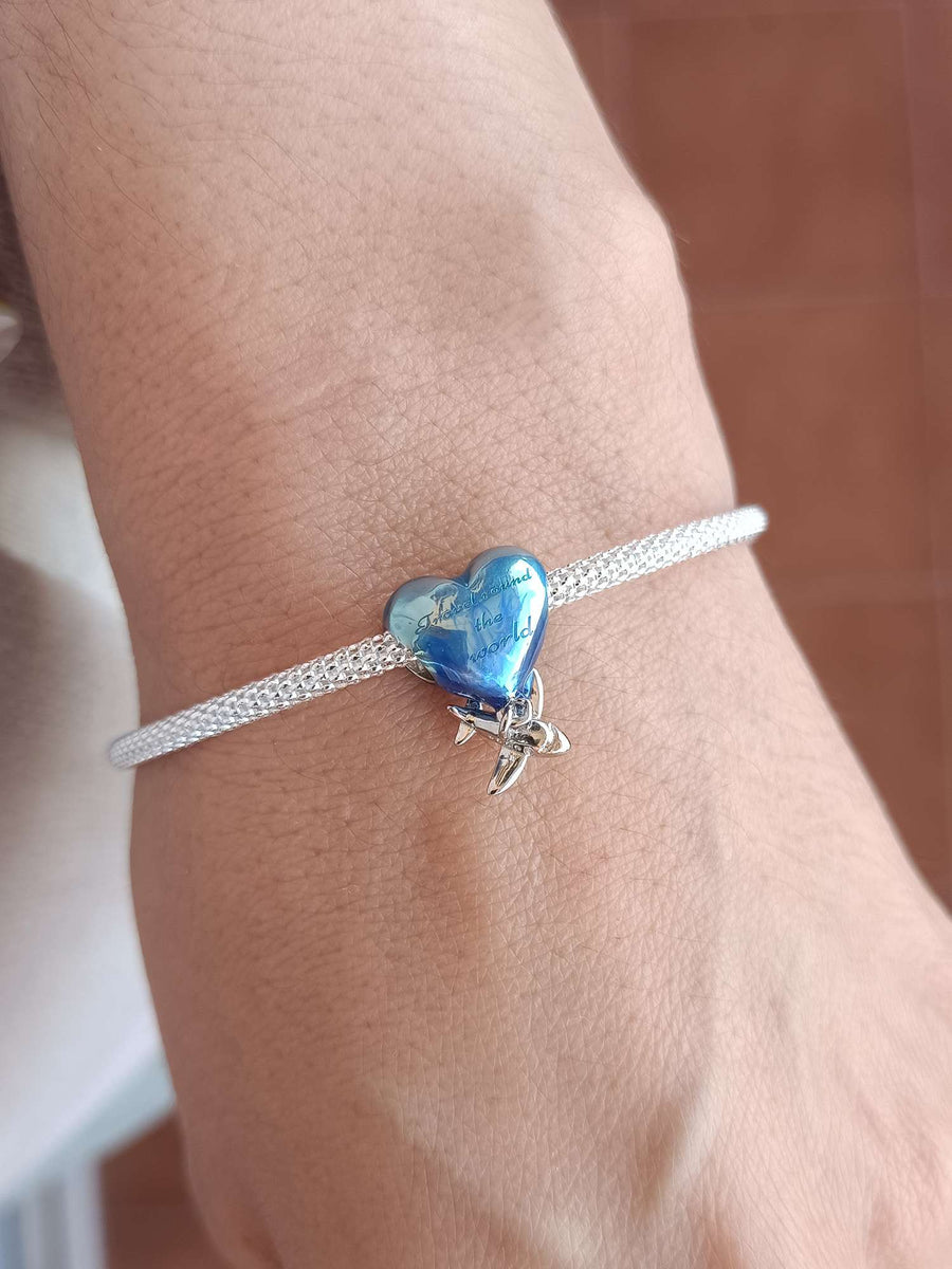 Charm corazón viajero