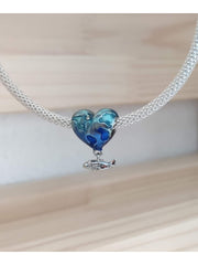Charm corazón viajero