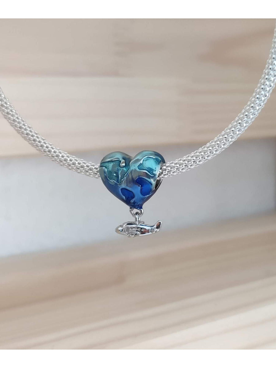 Charm corazón viajero